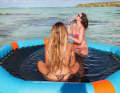 The Hana Party Pool from Decathlon offers a sunbathing area in the water next to the boat.