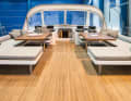 Sprayhood, sunbathing areas and tables show the cruising project