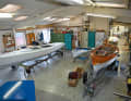 The main workshop is located behind the former residential building. The hall grew, as did the portfolio