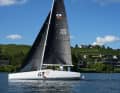 The tall, slim carbon fibre rig is positioned far back in the boat. The forestay is also set noticeably far back