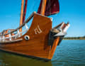 Typical: the ends of the boat are raised, two eyes on the bow are supposed to drive away demons