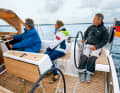 Dufour 350: The seats for the helmsman severely restrict the lateral seating position, behind the wheel it gets cramped. Folding them up doesn't help, but leaving them out does. The sheet winches are within easy reach of the helmsman