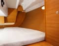 Dufour 350: The cover of the steering mechanism severely restricts the freedom of movement for the feet. There are no open storage compartments aft for small items. The larger berth in the version with two cabins is 1.60 metres wide at shoulder height