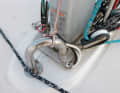 Execution: The gooseneck is a solid way to lead cables below deck. Line as sheet protection