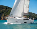 With charms. The many and large windows and the moderate deck step camouflage the enormous hull volume