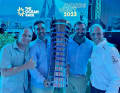 Happy ending after the crash in The Hague: "Guyot" team manager Jens Kuphal (right) and co-skipper Robert Stanjek (left) on stage with 11th Hour Racing's victorious skipper Charlie Enright and US team boss Mark Towill