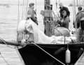 A police officer inspects the "Pen Duick" in West Wales after Tabarly went overboard on her