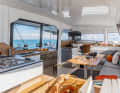 Compact. The saloon, galley and sat nav are at cockpit level. There are open shelves instead of cupboards