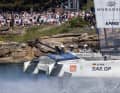 The Germany SailGP Team, steered by Erik Heil, passes the cheering fans on Genesis Island on the way to their first race win in the Formula 1 of sailing