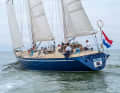 A ship like a castle: high hull, solid rigging and doghouse look sturdy