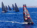 The 19 metre long "Flying Nikka" foils away from the 30 metre maxis