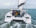 Width runs. The twelve-metre cat in rough sailing and almost without heeling