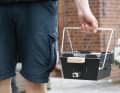 The feet become a carrying handle during transport