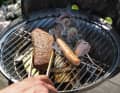 The grease drips under the burner, making cleaning difficult