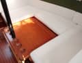 Lowerable table creates a large sea berth
