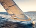 Silver lining in the sailing sky: "Cefea" owner Marc Giorgetti enjoys the steering position downwind.