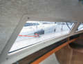 Leaky windows: Windows that were previously screwed on can leak due to stress cracks or UV radiation or simply become unsightly due to scratches. Replacing them with glued-on new windows is simple and looks great. The fore hatch, the bilge system and the backstay bushings should also be checked for leaks
