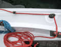 Double benefit: The curry cleat for the forward-guided sheet sits on a platform that also serves as a handle for hanging