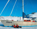 Arrived: The Haferkamp family in front of their ship in the ice off Greenland. The large water tanks are empty to protect them from the frost. Thawed snow serves as drinking water