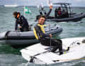 ... and raises his winning fist to the sky above Dun Laoghaire.