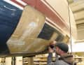 He has cut out defective laminate and is now rebuilding it