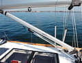 A downhaul that also serves as a boom support when recovering sails