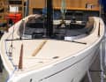 Typical daysailer. Flat deck, hardly any cabin superstructure, slim lines
