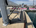 The carbon fibre rig with rod shrouds is an option. The deck cover with imitation teak is standard