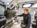 Boris Herrmann's co-skipper Will Harris at work below deck.