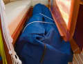 Below deck, the dinghy often blocks the footwell