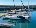 "Meganisi" at the jetty. Mast positioned far aft with plenty of halyard, brute-looking bow