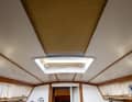Fitting: After two coats of paint, the panels are an even white colour and can be refitted. The contrast with the wooden cover mouldings stretches the salon as desired