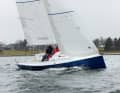 Layered and attractive. The slender hull with little freeboard and a vertical stem is typical of Alan Johnstone's designs.