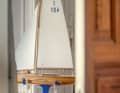 At home, a wooden model of the J-dinghy "Aera II" with an extra-long keel recalls the adventures of Manfred Curry