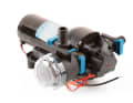Pressurised water pump with integrated switch