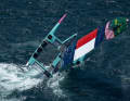 After capsizing, the US catamaran is righted by the support team. The wing sail has been damaged.