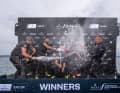 No mercy for the helmsman: Erik Kosegarten-Heil is bathed in champagne.