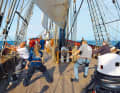 Crew and trainees move on board the brig "Roald Amundsen" at the same end