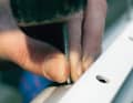 Now pull the rest of the pin out of the pliers, insert it into the rivet from above and use it to drive through the loose rest of the pin. Otherwise it would corrode later