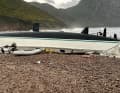 Thrown upside down at anchor, then stranded. Lightweight cat off the west coast of Corsica, where a storm raged at up to 90 knots