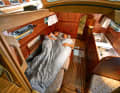 The saloon of the Biga 242 works somehow.  Most of the flexible berths are severely restricted. You have to like each other to be able to sleep peacefully here as a couple