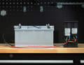 The LE300 module is connected to the positive and negative terminals of the existing battery