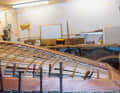 Köhn bent the steamed oak frames over this, onto which the glued planks were screwed