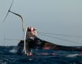The capsized test boat of the Italians