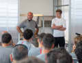Peter Burling with Luna Rossa's CEO Max Sirena at a team meeting.
