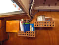 Always ready for touch-ups: paint and brushes have their own shelf in the baking box