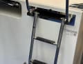 Osculatis EasyUp telescopic swim ladder for stowing in the swim platform. To the left is the version for mounting under the bathing platform.