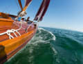 In the gusts of the offshore breeze, the classic with its set topsail lies on its cheek