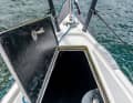 The forepeak is large enough to store the fenders. The water remains in the recess for the lid