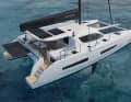 The boom is run close over the cabin top. Hoisting the mainsail into the lazybags is easy